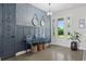 Stylish entryway features decorative mirrors, table with storage, and natural light at 6200 Alligator Lake E Shr, St Cloud, FL 34771