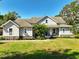 Charming two-story home featuring a well-manicured lawn and inviting front porch at 6200 Alligator Lake E Shr, St Cloud, FL 34771