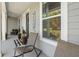 Relax on the charming front porch and enjoy the peaceful neighborhood ambiance and welcome sign at 6200 Alligator Lake E Shr, St Cloud, FL 34771