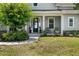Inviting front porch with landscaping creates a warm welcome to this lovely home at 6200 Alligator Lake E Shr, St Cloud, FL 34771