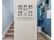 Bright hallway featuring a staircase, a photo display, and a utility space at 6200 Alligator Lake E Shr, St Cloud, FL 34771