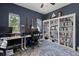 Well-lit home office with guitar accents, ample desk space, and shelving for an inspiring and organized workspace at 6200 Alligator Lake E Shr, St Cloud, FL 34771