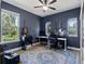 Bright home office featuring natural light, guitars, and ample workspace for a creative and productive environment at 6200 Alligator Lake E Shr, St Cloud, FL 34771