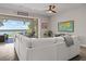 Inviting living room with lake views, comfortable seating, and seamless access to the outdoor patio area at 6200 Alligator Lake E Shr, St Cloud, FL 34771
