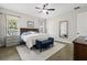 Serene main bedroom with a ceiling fan, windows, a bench, a dresser, and carpet at 6200 Alligator Lake E Shr, St Cloud, FL 34771