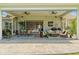 Large screened patio featuring multiple seating areas with sliding glass doors at 6200 Alligator Lake E Shr, St Cloud, FL 34771