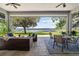 This covered patio offers beautiful lake views and seating areas at 6200 Alligator Lake E Shr, St Cloud, FL 34771
