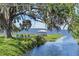 Scenic waterfront view with a dock, gazebo, and lush greenery at 6200 Alligator Lake E Shr, St Cloud, FL 34771