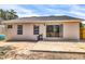 Backyard with a concrete patio and sliding glass doors leading inside at 6593 Meritmoor Cir, Orlando, FL 32818