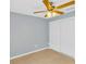 Bright bedroom featuring tile flooring, a ceiling fan, and a closet with bi-fold doors at 6593 Meritmoor Cir, Orlando, FL 32818