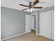 Bedroom featuring tile floors, ceiling fan, and closet for storage at 6593 Meritmoor Cir, Orlando, FL 32818