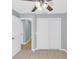 Bedroom featuring tile floors, ceiling fan, closet, and natural light at 6593 Meritmoor Cir, Orlando, FL 32818