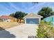 Inviting home with an attached garage and extended concrete driveway at 6593 Meritmoor Cir, Orlando, FL 32818