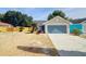 Charming home featuring an attached garage and landscaped front yard at 6593 Meritmoor Cir, Orlando, FL 32818