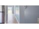 Hallway featuring updated tile flooring and an open floor plan at 6593 Meritmoor Cir, Orlando, FL 32818