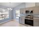 Charming kitchen featuring sleek appliances and plenty of natural light at 6593 Meritmoor Cir, Orlando, FL 32818