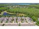 Stunning aerial view capturing the serene neighborhood near the forest, complete with a pond and nicely arranged homes at 6632 Pasturelands Pl, Winter Garden, FL 34787