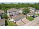 An aerial view showing home with garage, lawn, and surrounding landscaping at 6632 Pasturelands Pl, Winter Garden, FL 34787