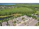 Picturesque aerial view showcasing a neighborhood near a lush forest, with pond views and well-kept residences at 6632 Pasturelands Pl, Winter Garden, FL 34787