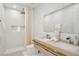 Bright bathroom with a double vanity, shower with curtain, and marble-style tile for a clean, modern look at 6632 Pasturelands Pl, Winter Garden, FL 34787