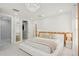 Bright bedroom with wood accents, chandelier lighting and walk-in closet at 6632 Pasturelands Pl, Winter Garden, FL 34787