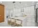 Bright kitchen with a large central island, modern decor and lighting, and seamless connection to the open living space at 6632 Pasturelands Pl, Winter Garden, FL 34787