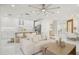 Open concept living room seamlessly connects to a kitchen, enhancing modern living with style and comfort at 6632 Pasturelands Pl, Winter Garden, FL 34787