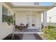 Charming outdoor patio with a table and chairs, perfect for enjoying a relaxing outdoor meal at 6632 Pasturelands Pl, Winter Garden, FL 34787