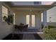 Charming outdoor patio with a table and chairs, perfect for enjoying a relaxing outdoor meal at 6632 Pasturelands Pl, Winter Garden, FL 34787