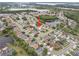 Aerial view of the neighborhood showcasing the property's location near a pond and more at 6714 Bouganvillea Crescent Dr, Orlando, FL 32809