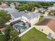 Aerial view of home with screened-in pool and neighboring homes at 6714 Bouganvillea Crescent Dr, Orlando, FL 32809