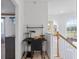 Cozy landing area featuring a workstation setup, natural light, and railing at 6714 Bouganvillea Crescent Dr, Orlando, FL 32809