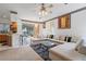 Bright living room with an open layout that flows seamlessly into the kitchen and outdoor space at 6714 Bouganvillea Crescent Dr, Orlando, FL 32809
