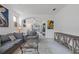 Comfortable living room featuring stylish decor, neutral colors, and views into other rooms of the home at 6714 Bouganvillea Crescent Dr, Orlando, FL 32809