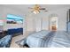 Spacious main bedroom offering a TV, ensuite bath, and neutral tones with an arched doorway at 6714 Bouganvillea Crescent Dr, Orlando, FL 32809