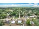 Neighborhood aerial featuring single-Gathering homes with lush greenery and landscaping at 690 W Pearl St, Bartow, FL 33830