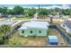 Aerial view of the home showcasing backyard, perimeter fence, and neighborhood at 690 W Pearl St, Bartow, FL 33830