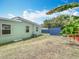 Landscaped backyard with storage shed, wooden fence, and ample green space at 690 W Pearl St, Bartow, FL 33830