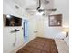 A bedroom featuring a ceiling fan, TV, and two closets offering ample storage at 690 W Pearl St, Bartow, FL 33830