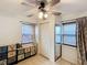 A bedroom featuring a ceiling fan, ample natural light, and a closet at 690 W Pearl St, Bartow, FL 33830