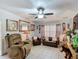 Comfortable living room showcasing tile floors, a ceiling fan, and stylish decor at 690 W Pearl St, Bartow, FL 33830
