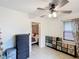 An open room with decorative dressers, tile flooring, and a ceiling fan with light fixture at 690 W Pearl St, Bartow, FL 33830