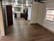 Bright open-concept living space features a spacious kitchen and hardwood floors at 6937 Gibraltar Rd, Orlando, FL 32822