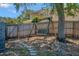 Backyard features a charming swing hanging from a tree, perfect for relaxing outdoors at 7218 Alston Ct, Orlando, FL 32835