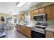 Fully equipped kitchen featuring stainless steel appliances, quartz countertops, and ample cabinet space at 7218 Alston Ct, Orlando, FL 32835