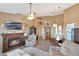 Inviting living room with fireplace and ample seating, perfect for cozy evenings at home at 7218 Alston Ct, Orlando, FL 32835