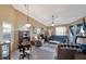 Spacious living room with high ceilings, tiled floor, and comfortable seating, ideal for relaxation and entertaining at 7218 Alston Ct, Orlando, FL 32835