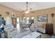 Bright and airy living room seamlessly connects with dining and kitchen areas, creating an open floor plan at 7218 Alston Ct, Orlando, FL 32835