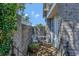 Private patio area with brick walls, wrought iron table and chairs, and decorative plants at 7218 Alston Ct, Orlando, FL 32835