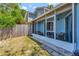 Back porch featuring screened in walls and room for plenty of seating at 7218 Alston Ct, Orlando, FL 32835